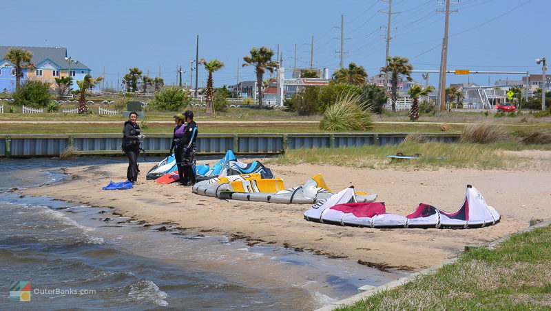A couple takes a kiteboarding lesson in Waves