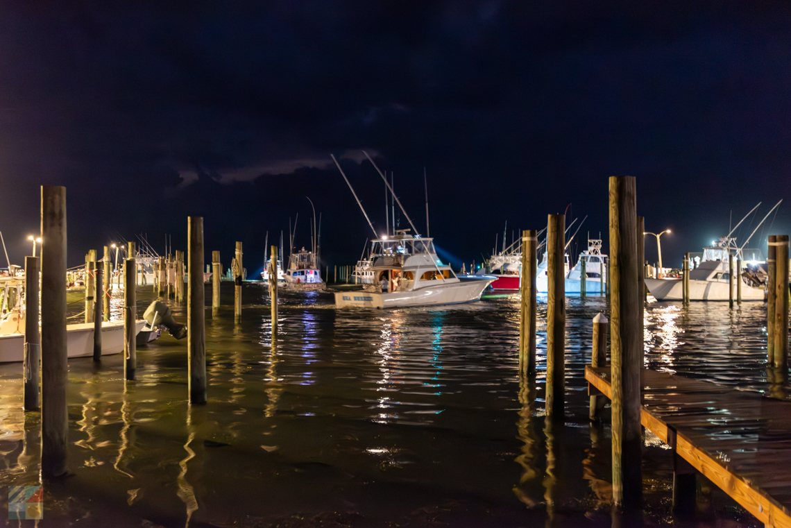 A fishing charter boat leaves pre-dawn from Oregon inlet